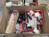 a box full of assorted items sitting on a table