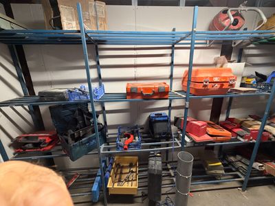 many tools on the shelves in the garage