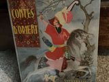 an old children ' s book with a picture of a woman riding a horse