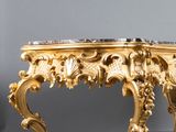 an image of a gold coffee table with a bowl on top of it