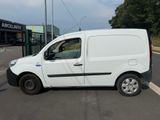a white van that is parked on the side of the road