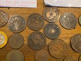 a lot of coins on the table with notes on them