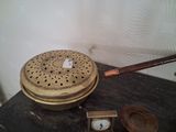 a clock sitting on a table next to a wooden box