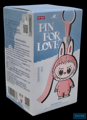 une boîte rose sur laquelle figure un lapin de dessin animé tenant une paire de ciseaux