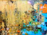 abstract painting of yellow, blue, and red colors on a wall