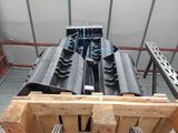 a wooden pallet that has a bunch of pipes attached to it