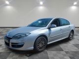 a picture of a silver car that is parked in a garage