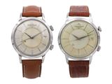 an image of a couple of watches sitting next to each other