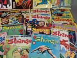 a lot of comic books sitting on a table