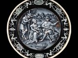 une assiette en noir et blanc sur laquelle figure l'image d'un homme et d'une femme