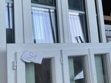 a window that has a sign on it in front of it