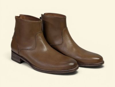a close up of a pair of brown boots on a white background