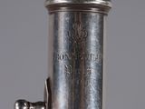 a close up of a silver metal object on a table
