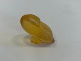 an image of a small yellow object on a white surface