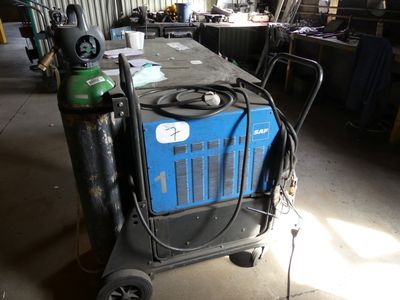 a blue machine that is sitting in a garage