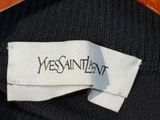 a label on a black sweater that says westin intent