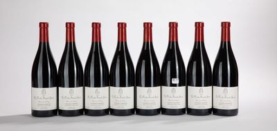 six bottles of red wine lined up in a row