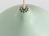 an image of a light green lamp with a gold shade