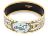 an image of a gold and blue bracelet with a horse on it