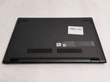 a black laptop with a sticker on the back of it