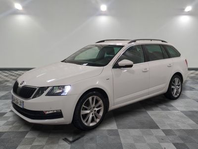 the white car is parked on a checkered floor in the garage