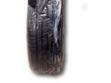 a tire that has been wrapped in plastic to protect it from the sun