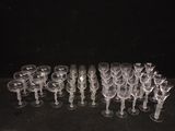 a lot of wine glasses sitting on a table