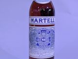 a bottle of wine that is sitting on a table