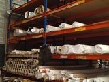 a large warehouse with a lot of shelves and pallets