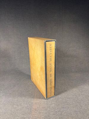 a book that is sitting on a table with a black background