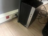 a computer that is sitting on the floor next to a wall