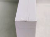 a close up of a piece of wood that has been painted white