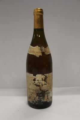 a bottle of wine that is sitting on a table