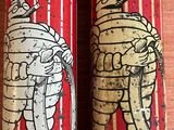 two tins with images of elephants on them sitting on a table
