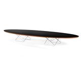 an oval table with a metal base and a black top