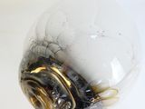 an image of a glass light bulb that has been blown over