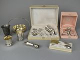 a box of silverware sitting on a table next to other items