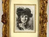 an old picture of a woman with a hat and a cigarette in a gold frame