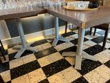 a table with wine glasses on it and a tray of wine glasses on the table
