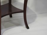 a small table with a glass top on a white background