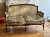 a couch that is sitting on a hard wood floor