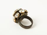 a close up of a ring on a white surface