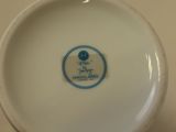 a white plate with a blue and white design on it