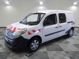 a white van with red and white stripes parked in a room