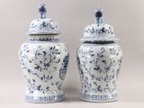 pair of blue and white vases with lids with birds and flowers