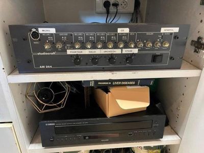 a shelf with a bunch of electronic equipment on it
