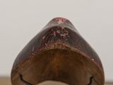 a close up of a wooden object on a table