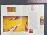 an open book with a picture of a painting on it
