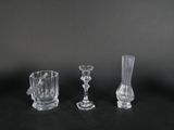 three glass vases sitting next to each other on a table