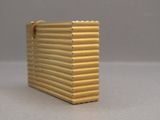 a small gold box that is sitting on a table